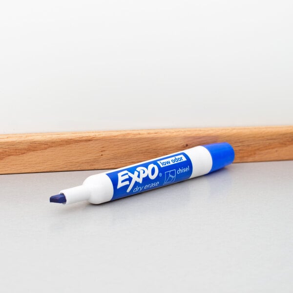 A close up of a blue Expo dry erase marker.