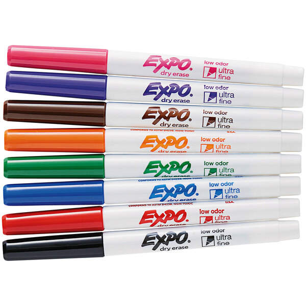 A set of Expo ultra fine point dry erase markers in a white tube with blue and green text and a variety of colorful markers.
