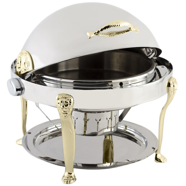 A Bon Chef stainless steel chafer with brass accents and lion legs with a silver and gold lid.