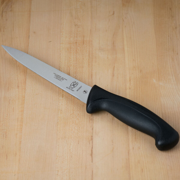 A Mercer Culinary Millennia 7" Flexible Fillet Knife with a black handle.
