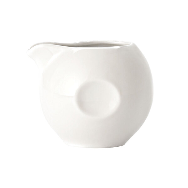 A Libbey white porcelain creamer with a round design.