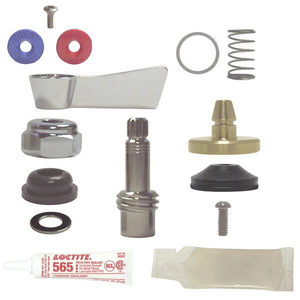 A Fisher 3/4" brass faucet check stem repair kit on a table with a variety of parts.