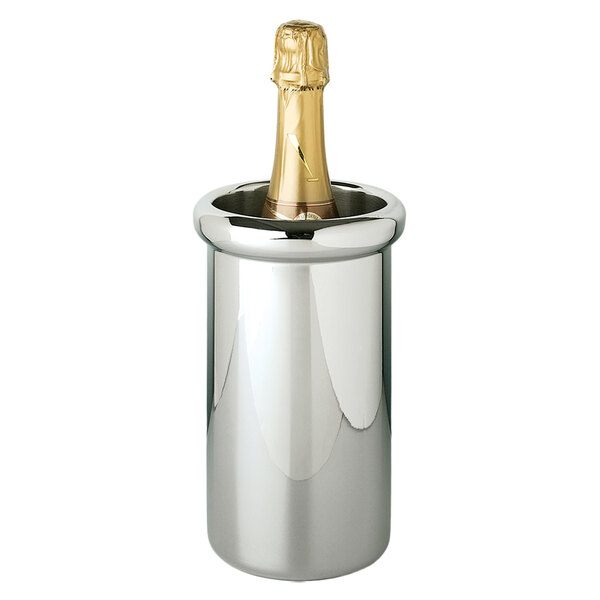 A champagne bottle in a Franmara stainless steel wine cooler on a table.