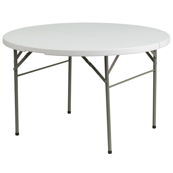 A Flash Furniture white round plastic folding table with metal legs.