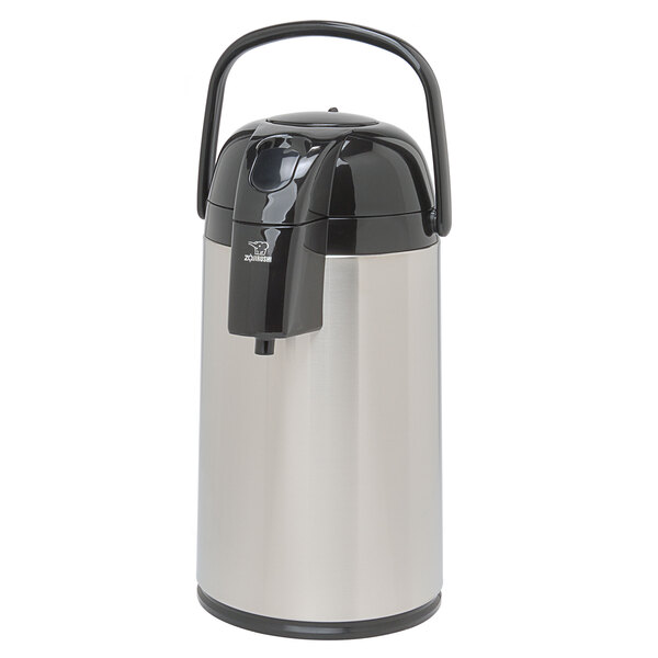 A stainless steel and black Grindmaster Zojirushi coffee airpot.