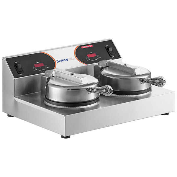 A Nemco commercial waffle maker with two round, non-stick waffle makers.