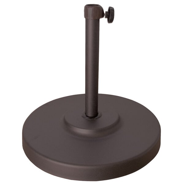 A bronze metal umbrella base with a black pole.