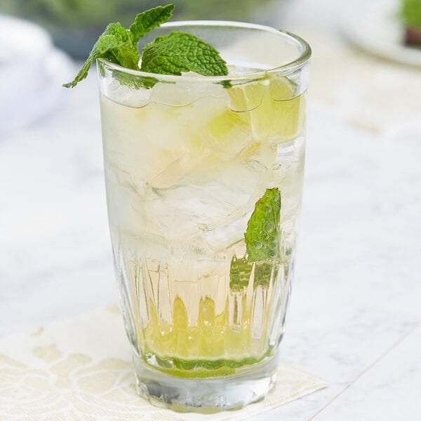 An Anchor Hocking Breckenridge beverage glass with ice, mint, and lime.