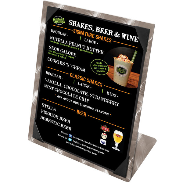An Alumitique aluminum menu tent with picture corners on a table in a juice bar.