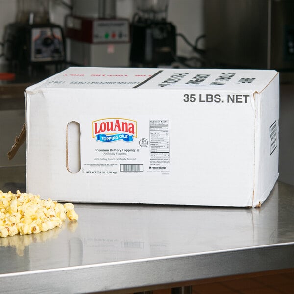 A white LouAna box of popcorn oil on a counter.