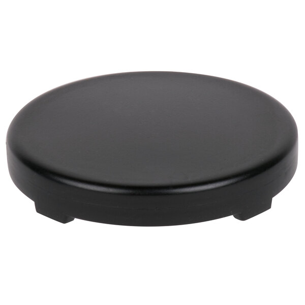 A black plastic circular cooling puck for mixology jars.