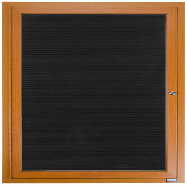 An Aarco outdoor directory board with a wooden frame and black vinyl letter board.