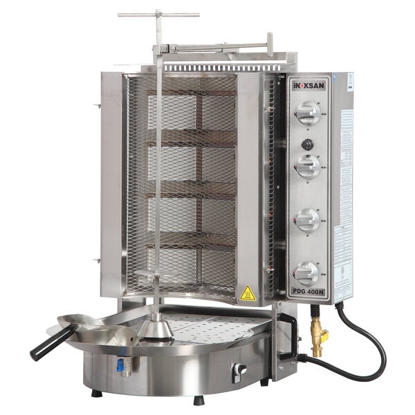 An Inoksan stainless steel natural gas doner kebab machine with a mesh shield.