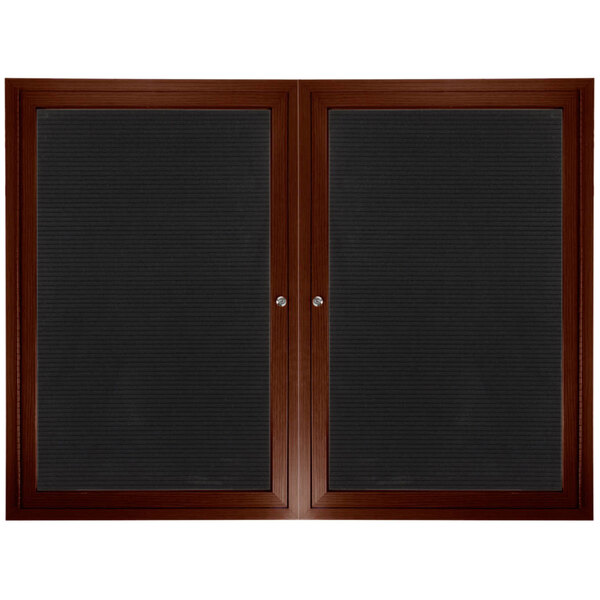A black framed Aarco directory board with black felt panels.