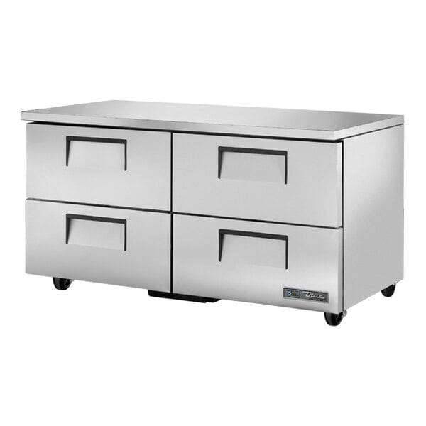 A stainless steel True undercounter refrigerator with four drawers.