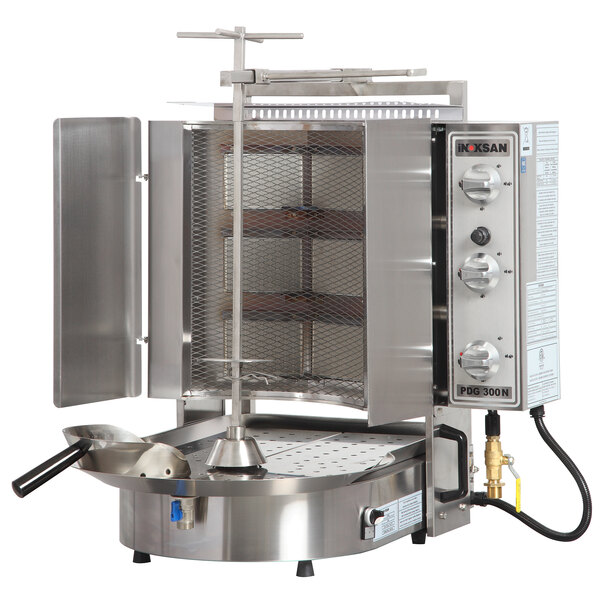An Inoksan stainless steel vertical broiler with a mesh shield over a grill.
