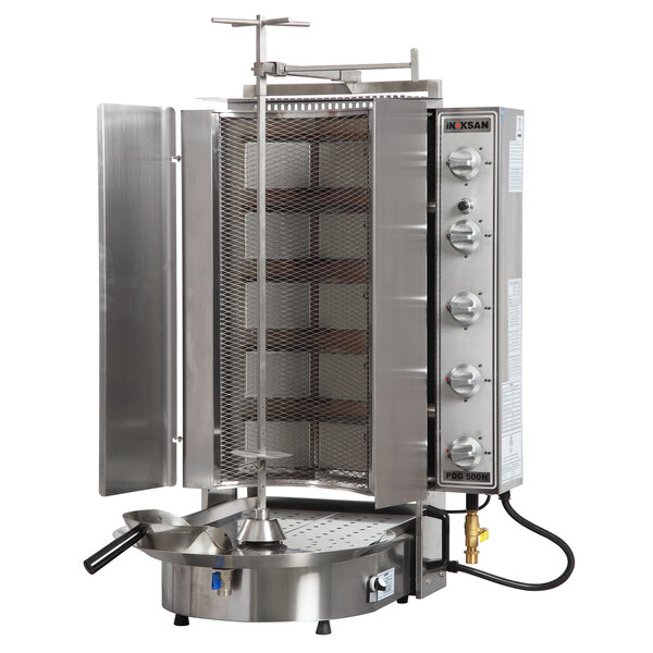 A large stainless steel Inoksan Doner Kebab Machine with a mesh shield over a large basket.