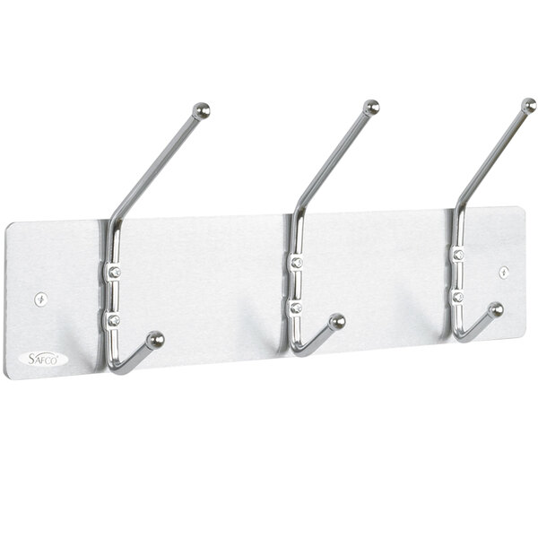 A Safco satin metal coat rack with three hooks.