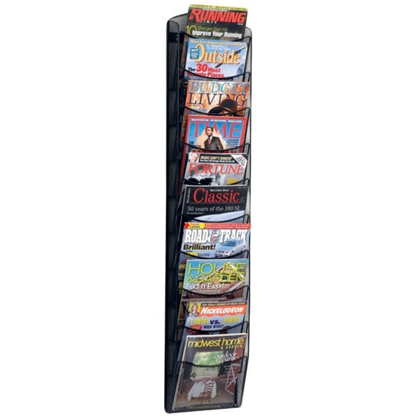 A Safco Onyx Mesh wall mount magazine rack filled with magazines.