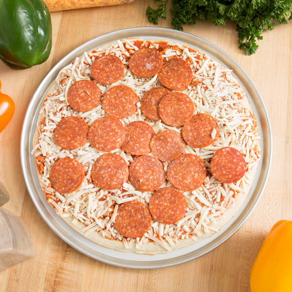 A deep dish pizza with pepperoni and cheese on an American Metalcraft deep dish pizza pan.