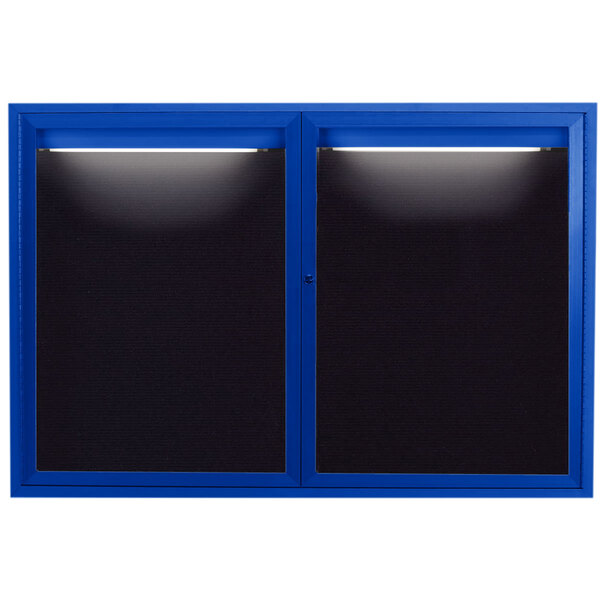 A blue aluminum bulletin board with black letter board with a light on top.