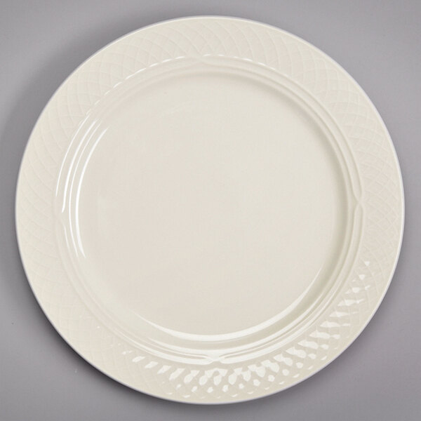 A white Homer Laughlin ivory china plate with a pattern on it.