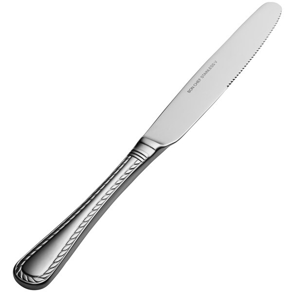 A close-up of a Bon Chef stainless steel European dinner knife with a solid handle.