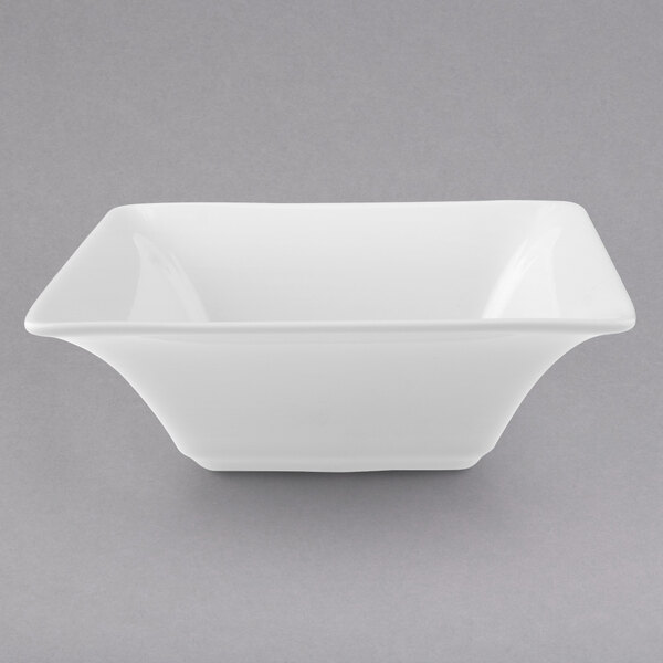A Villeroy & Boch white porcelain deep square bowl on a gray background.