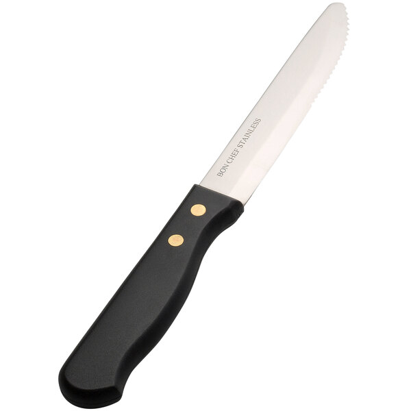 A Bon Chef steak knife with a black handle and gold trim.
