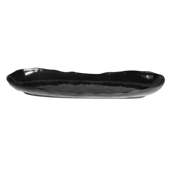 A black oval melamine tray with an uneven edge.