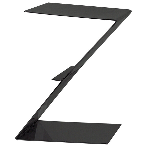 A black coated stainless steel Z-shaped riser on a table.