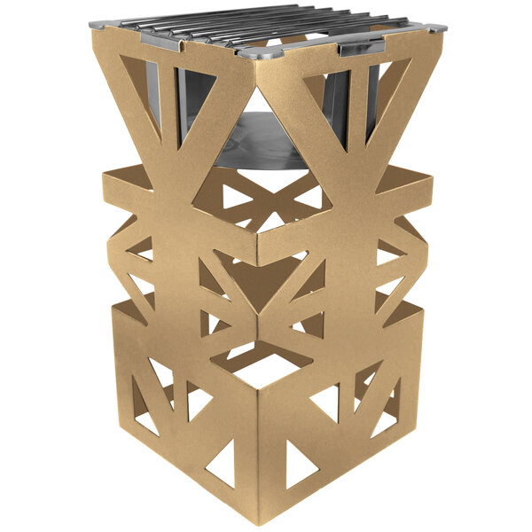 A bronze coated steel cube with a metal grate and metal structure.