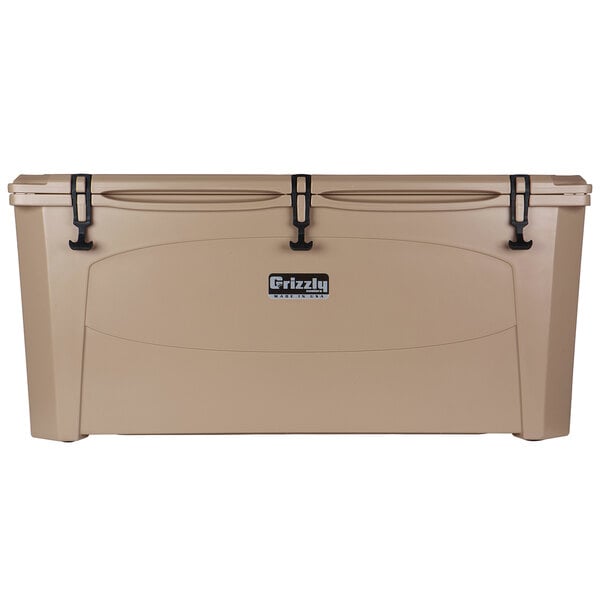 A tan Grizzly Cooler with black handles.