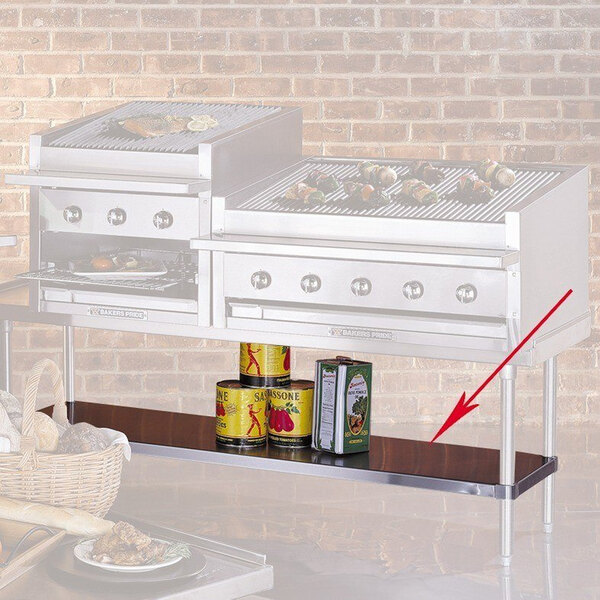 A Bakers Pride stainless steel outdoor charbroiler with food on the shelf.