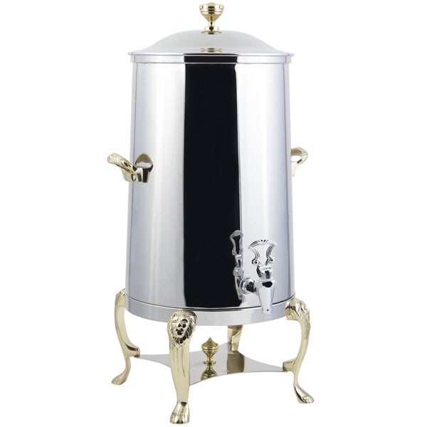 A Bon Chef stainless steel coffee chafer urn with brass and gold accents.