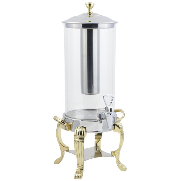A brass Bon Chef juice dispenser with a stainless steel ice chamber.