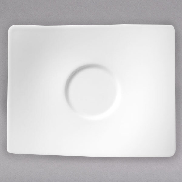 A white square plate with a circular ring in the middle.