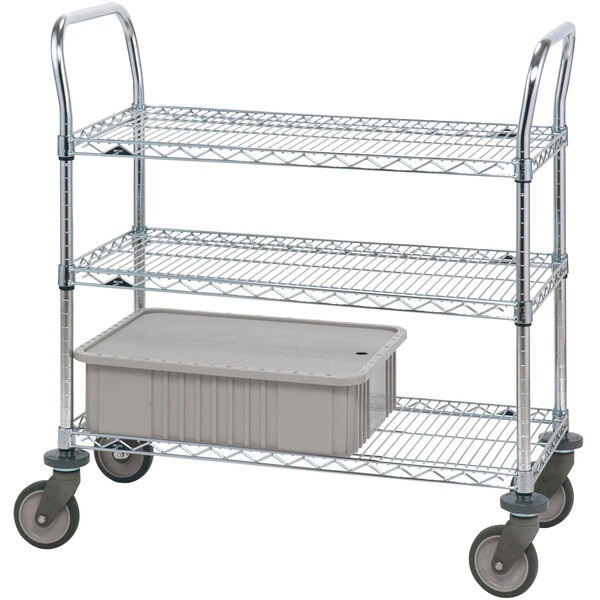 A three-tiered Metro stainless steel utility cart with polyurethane casters holding a plastic container.