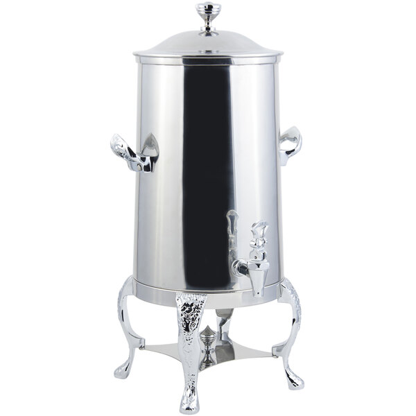 A silver metal Bon Chef coffee chafer urn with chrome trim on a stand.