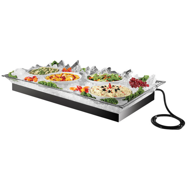 A Cal-Mil ice housing system on a table holding a tray of food with black olives.