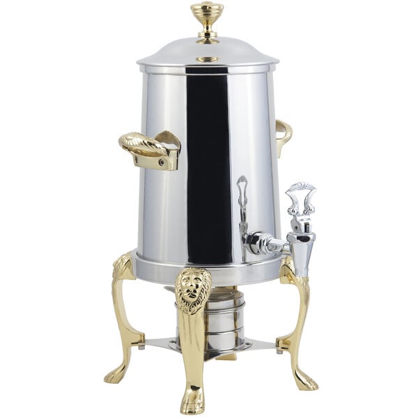 A silver and brass Bon Chef coffee chafer urn with a lion head spout.