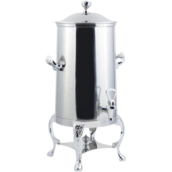 A silver metal Bon Chef coffee chafer urn with a lid and stand.