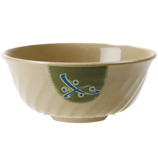 A close-up of a GET Japanese Traditional fluted bowl with a blue and green design on it.