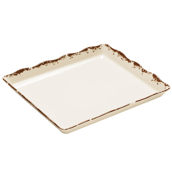 A white rectangular melamine display tray with brown spots.