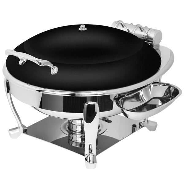 An Eastern Tabletop Crown black and silver stainless steel chafer on a table.