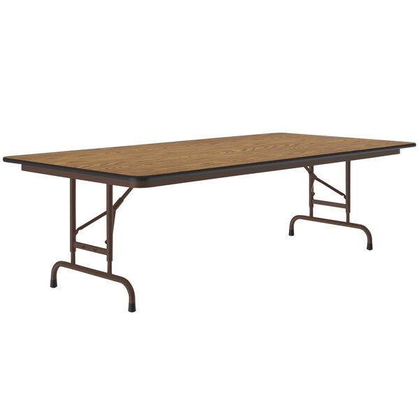 A Correll rectangular folding table with medium oak top and metal legs.