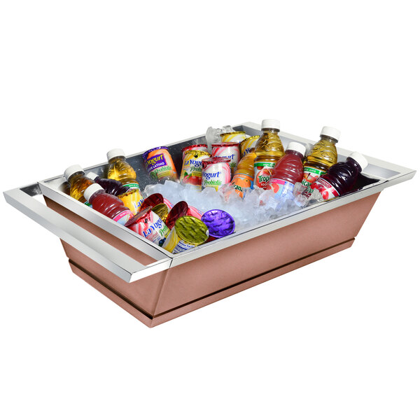 A copper coated stainless steel ice housing filled with bottles and ice on a counter.