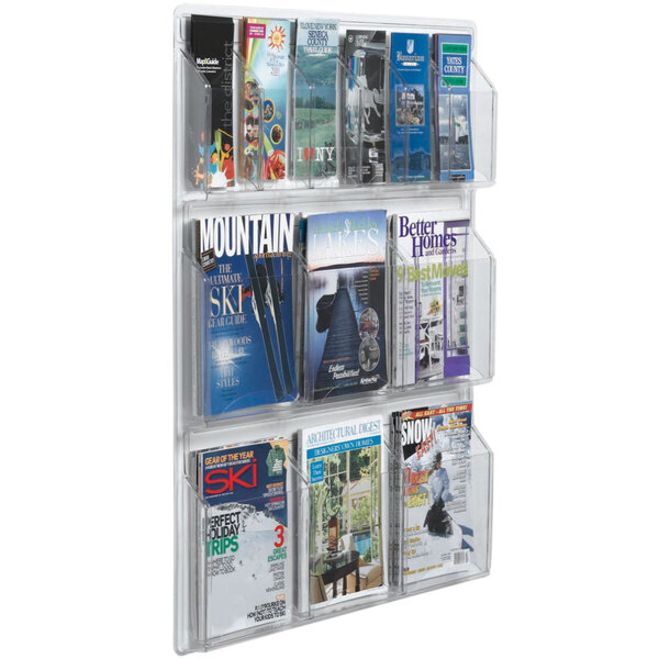A clear plastic magazine rack with pamphlets and magazines.