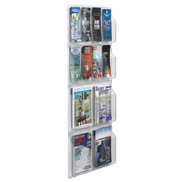 A clear plastic Aarco magazine rack with pamphlets and magazines.