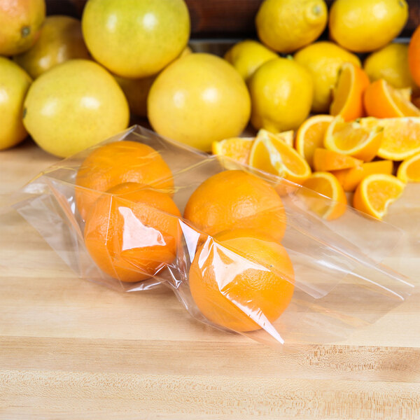 A group of oranges in LK Packaging plastic bags.